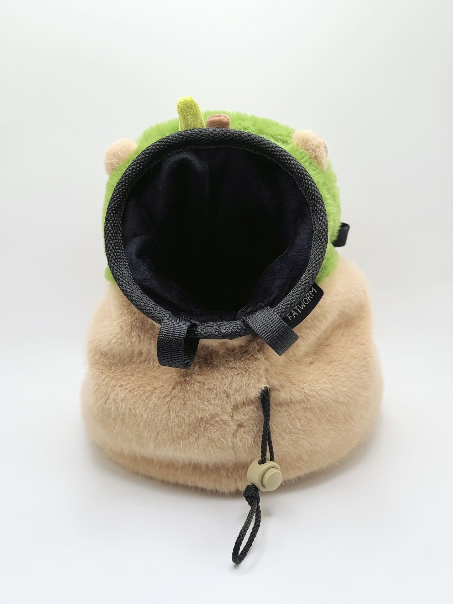 Handmade capybara-shaped climbing chalk bag dressed as avocado clutching a bubble tea cup