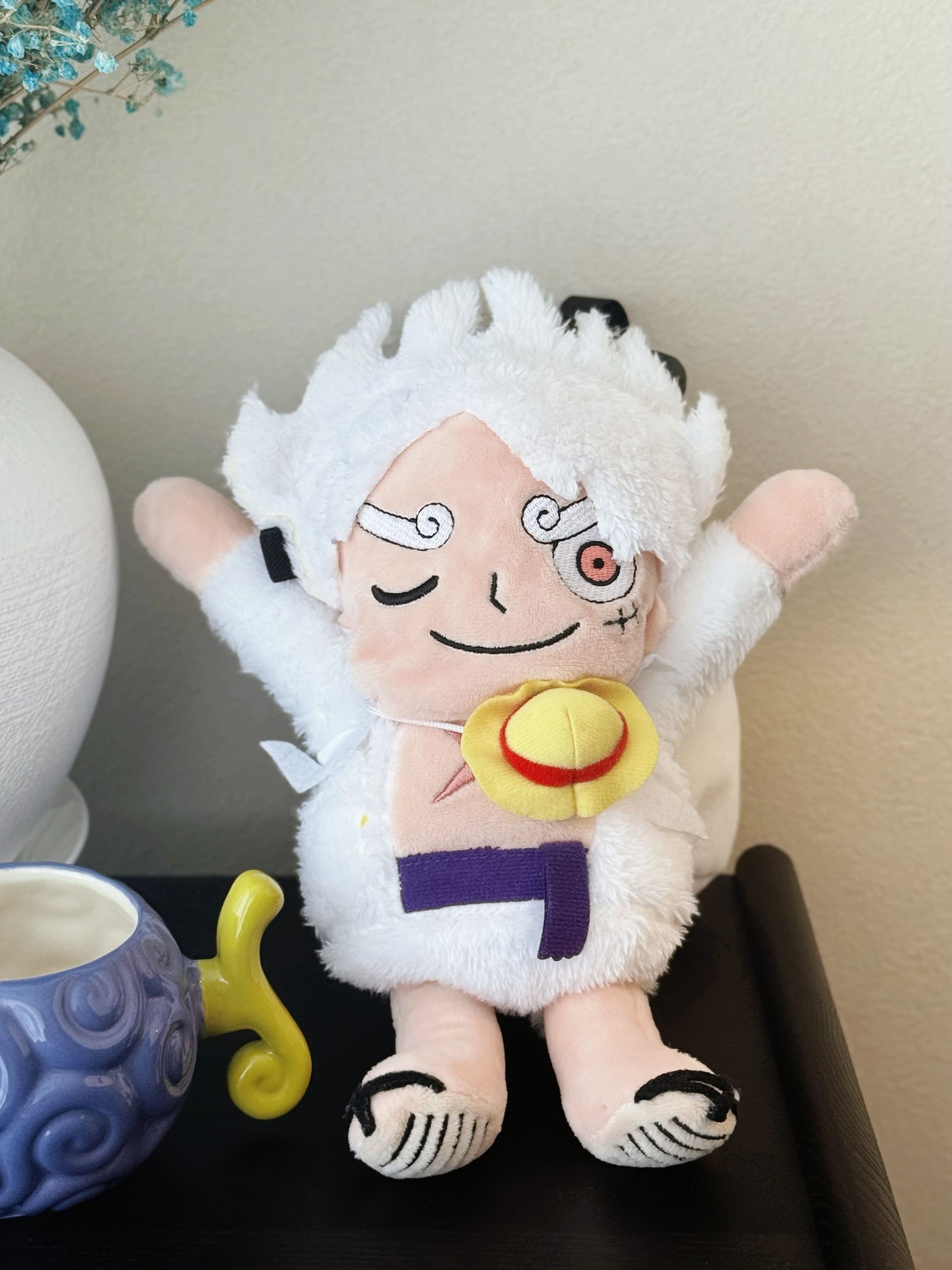 Luffy's Gear 5 transformation from One Piece Nika anime Climbing plush chalk bag, Functional climbing accessory with wide elastic opening and drawstring closure for bouldering or rock climbing.