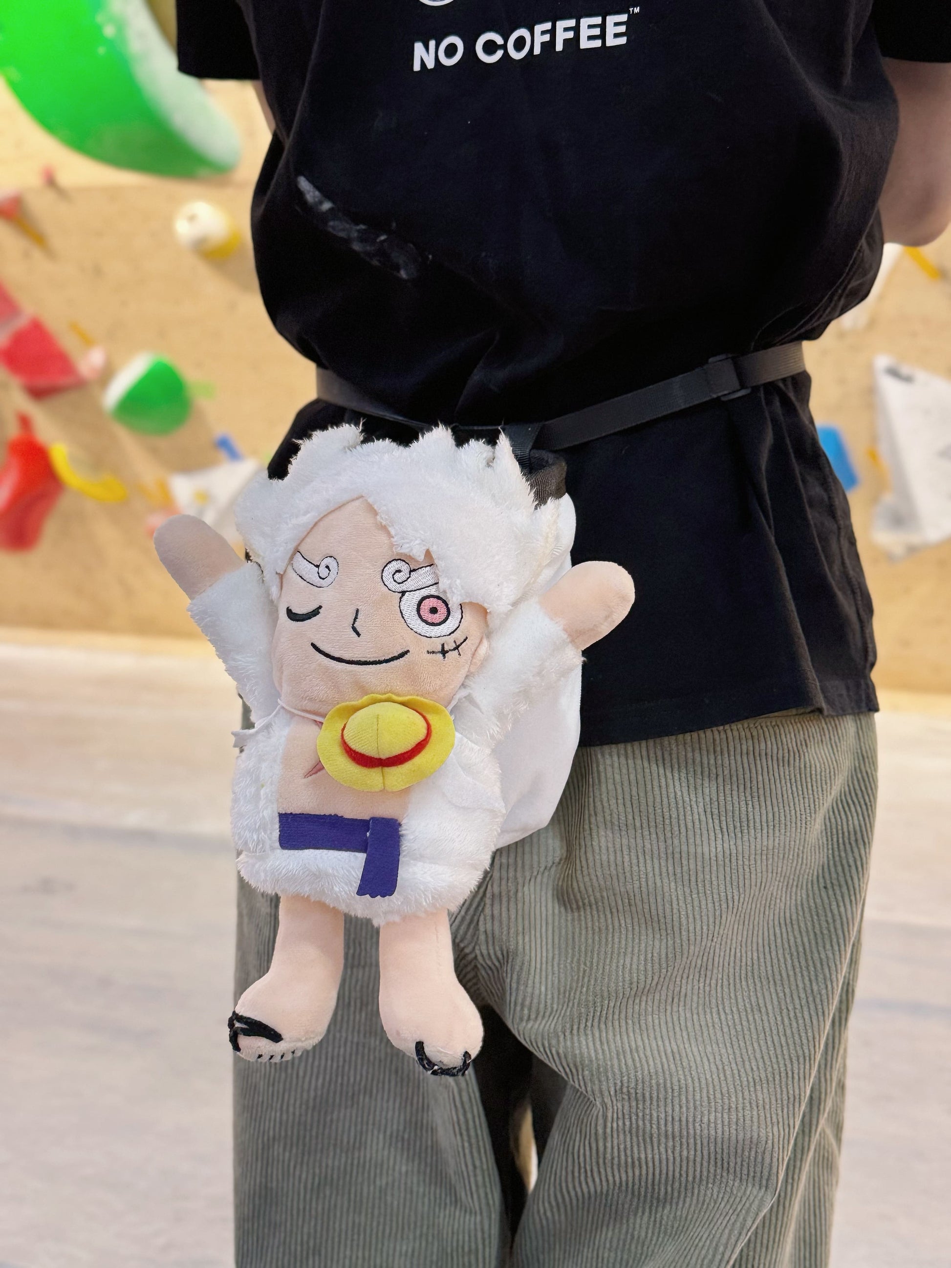 Luffy's Gear 5 transformation from One Piece Nika anime Climbing plush chalk bag, Functional climbing accessory with wide elastic opening and drawstring closure for bouldering or rock climbing.