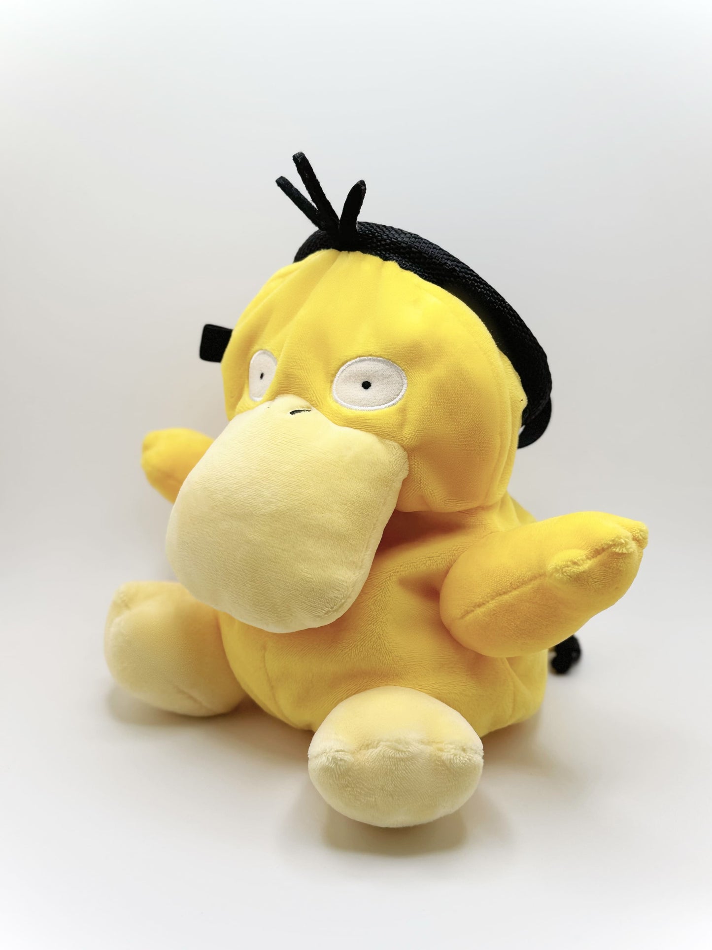 Handmade Psyduck plush anime chalk bags in two sizes – cute, functional climbing gear for bouldering enthusiasts and Pokémon fans by Fatworm Chalkbag