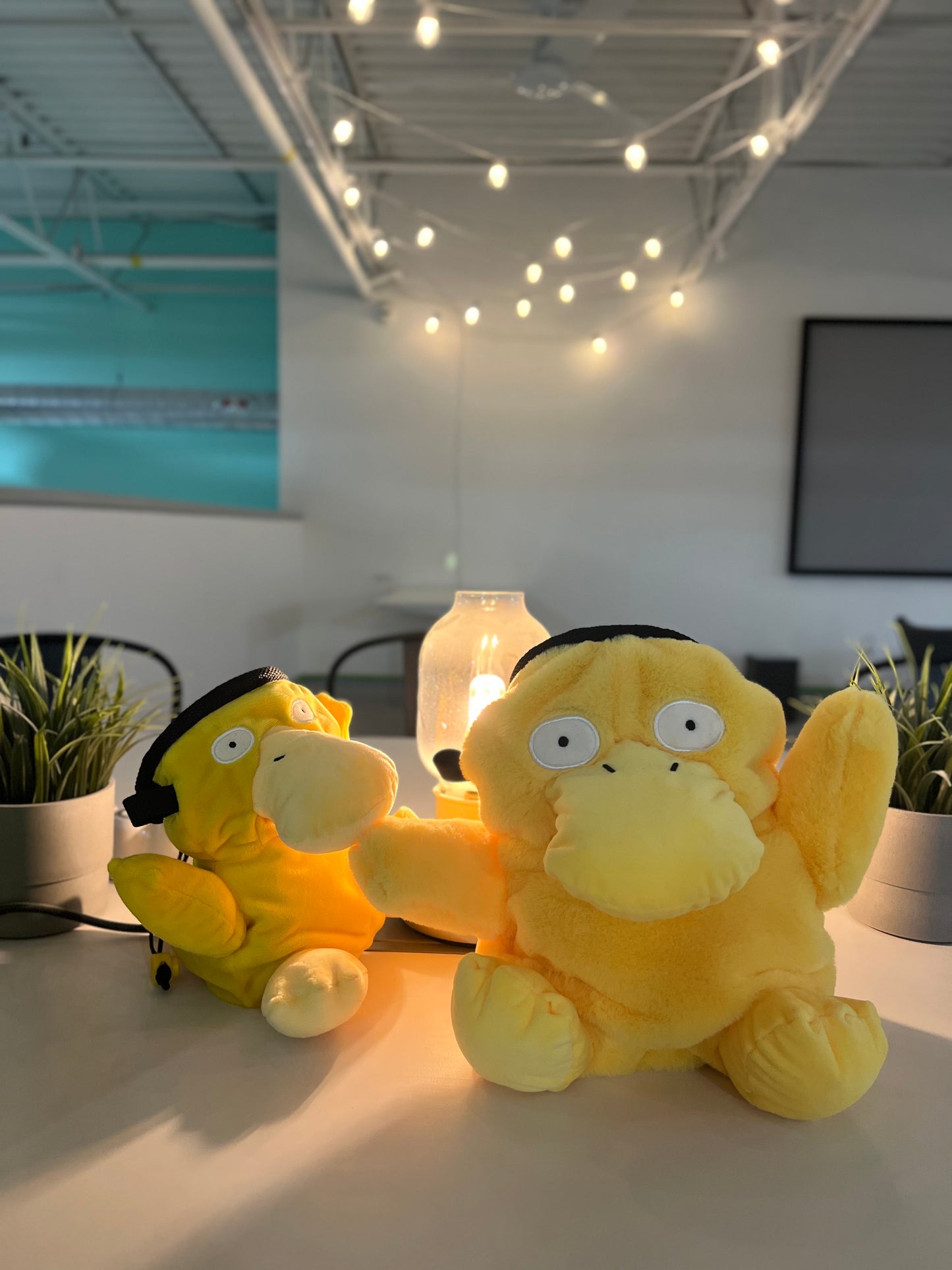 Handmade Psyduck plush anime chalk bags in two sizes – cute, functional climbing gear for bouldering enthusiasts and Pokémon fans by Fatworm Chalkbag