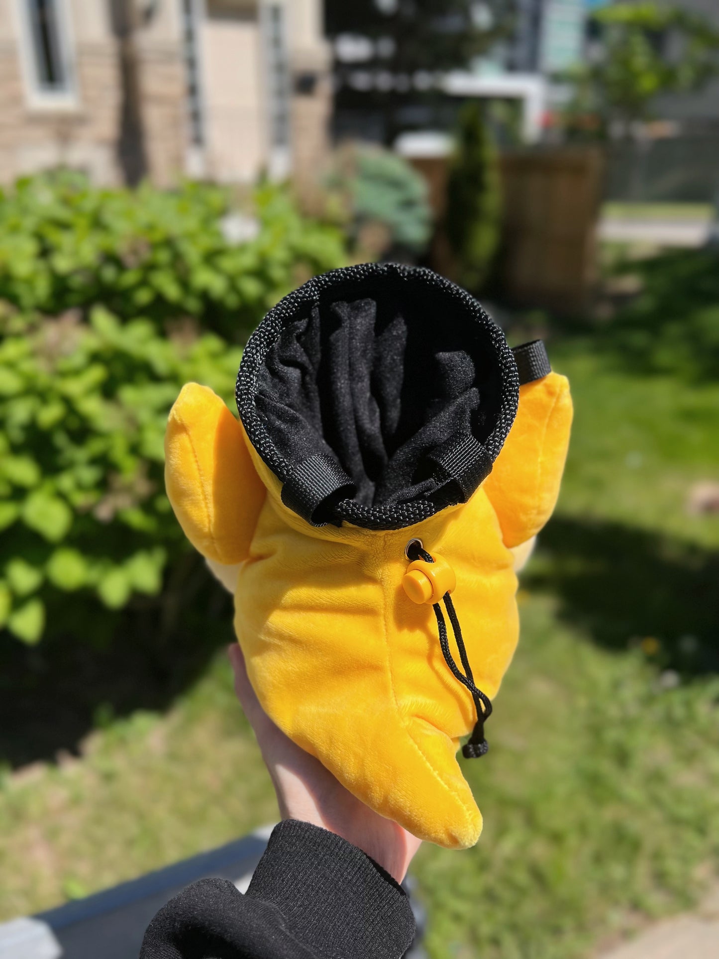 Handmade Psyduck plush anime chalk bags in two sizes – cute, functional climbing gear for bouldering enthusiasts and Pokémon fans by Fatworm Chalkbag