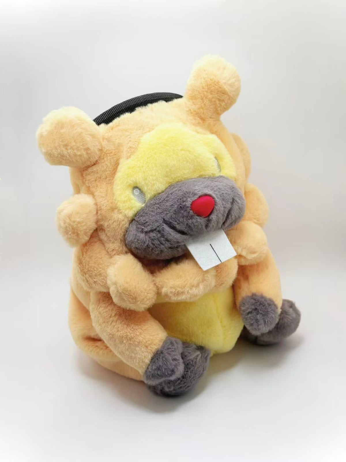 A cute, handmade plush climbing chalk bag made of extra-soft, fluffy material featuring Bidoof with chubby cheeks and iconic front teeth. Designed with high functionality by a climber, it includes a wide top rim opening, polar fleece lining, a brush loop, and a spill-proof drawstring. A great bouldering gift for rock climbers