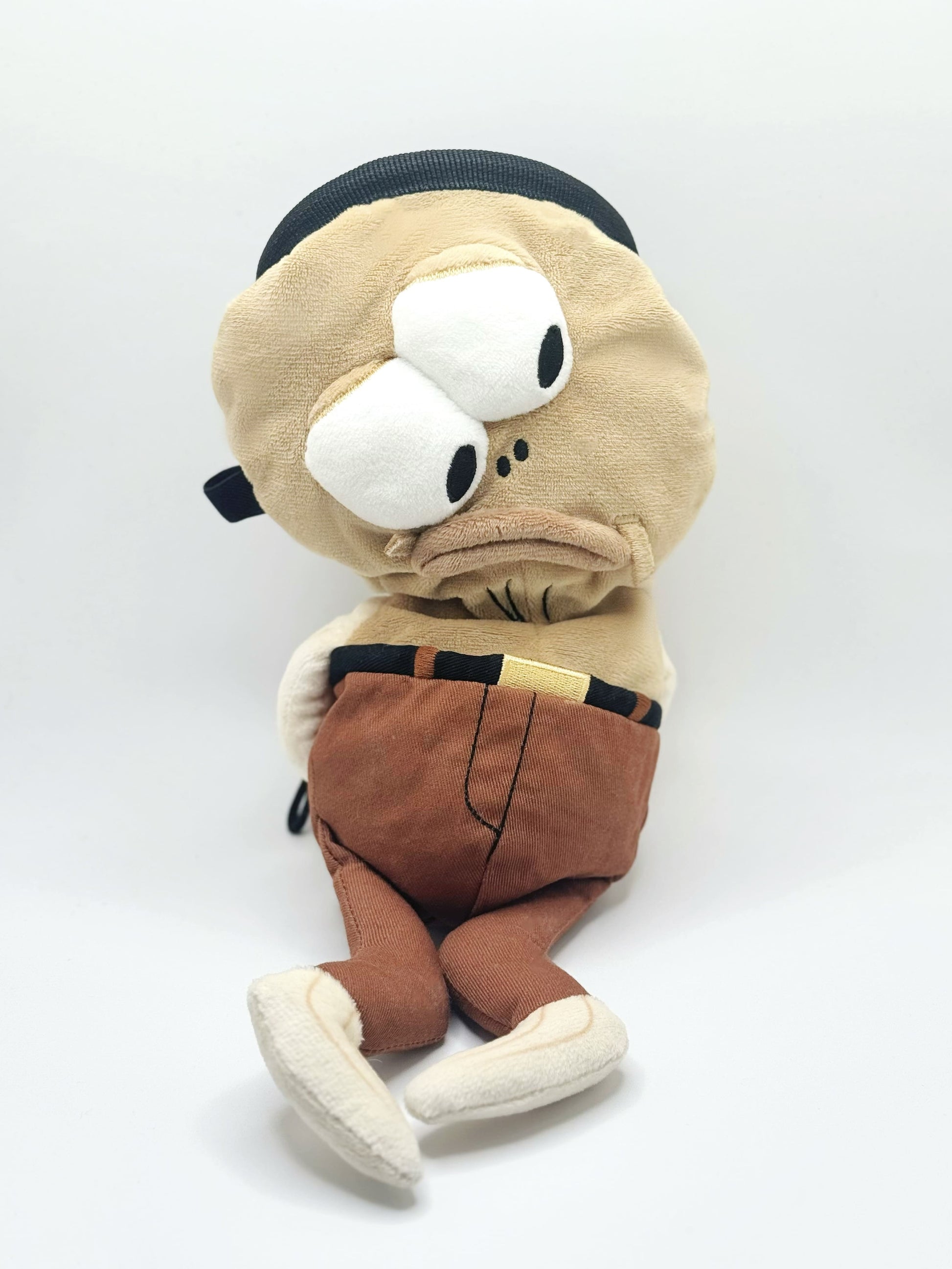 Dazed mocha brown and pink fish design on a cute plush chalk bag for rock climbing. Shows wide shocked eyes,  and a functional stiffened rim. A unique climbing gift for climbers.