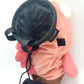 Dazed mocha brown and pink fish design on a cute plush chalk bag for rock climbing. Shows wide shocked eyes,  and a functional stiffened rim. A unique climbing gift for climbers.