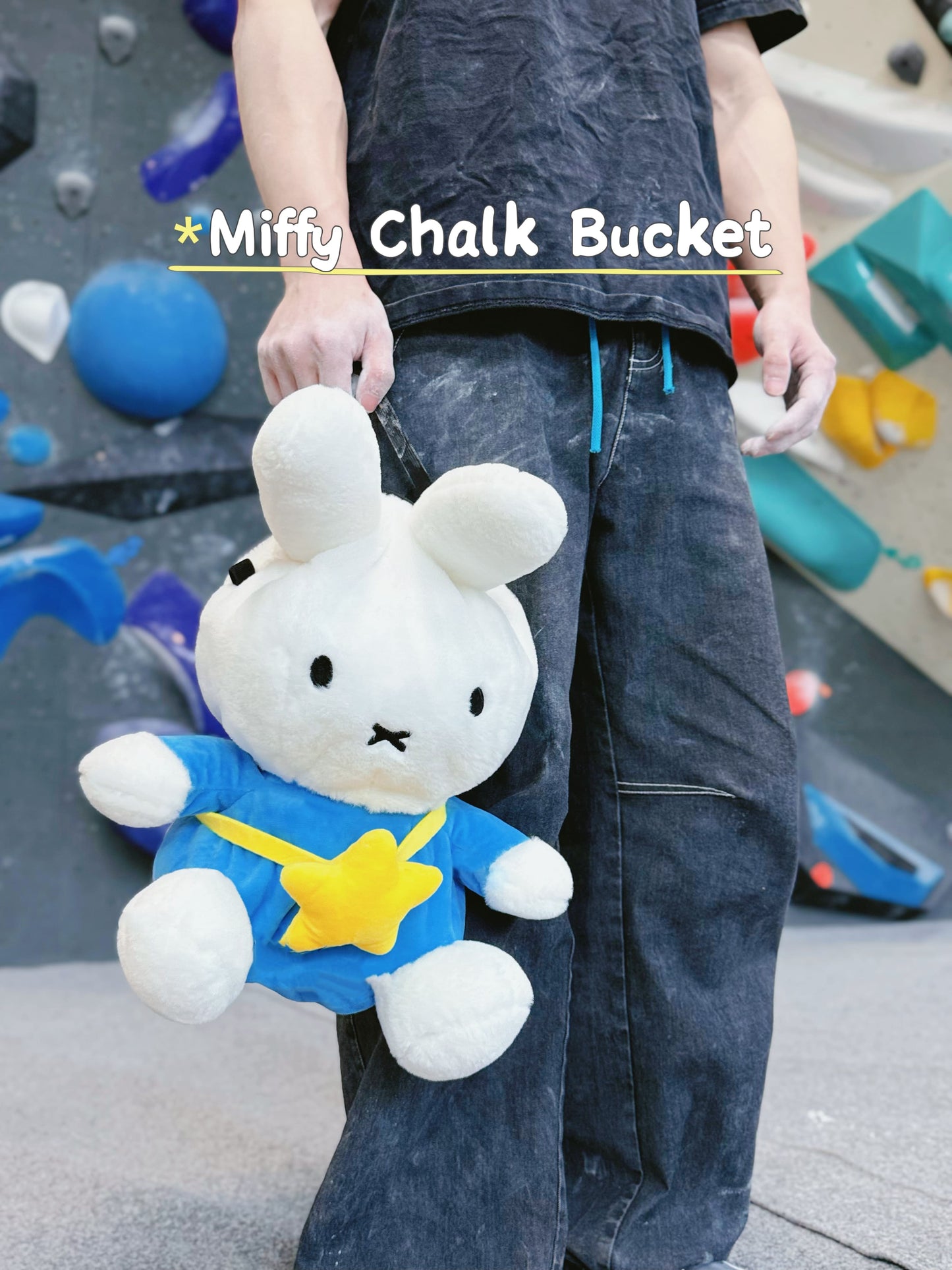A cute anime plush miffy chalk bag by FATWORM featuring a white Vanilla Bunny wearing a blue dress and a yellow star backpack. This functional and fluffy bouldering accessory is handmade for bouldering and climbing for rock climbing, offering a long-durable design that makes the perfect climbing gift for a climber.