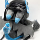 Handmade matte black plush climbing chalk bag shaped like a powerful dragon with bright electric blue wings and belly. Features small blue flame-like horns and aggressive embroidered eyes. Professional bouldering gear with a reinforced black rim, secure drawstring, and deep blue fleece lining.