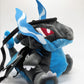 Handmade matte black plush climbing chalk bag shaped like a powerful dragon with bright electric blue wings and belly. Features small blue flame-like horns and aggressive embroidered eyes. Professional bouldering gear with a reinforced black rim, secure drawstring, and deep blue fleece lining.