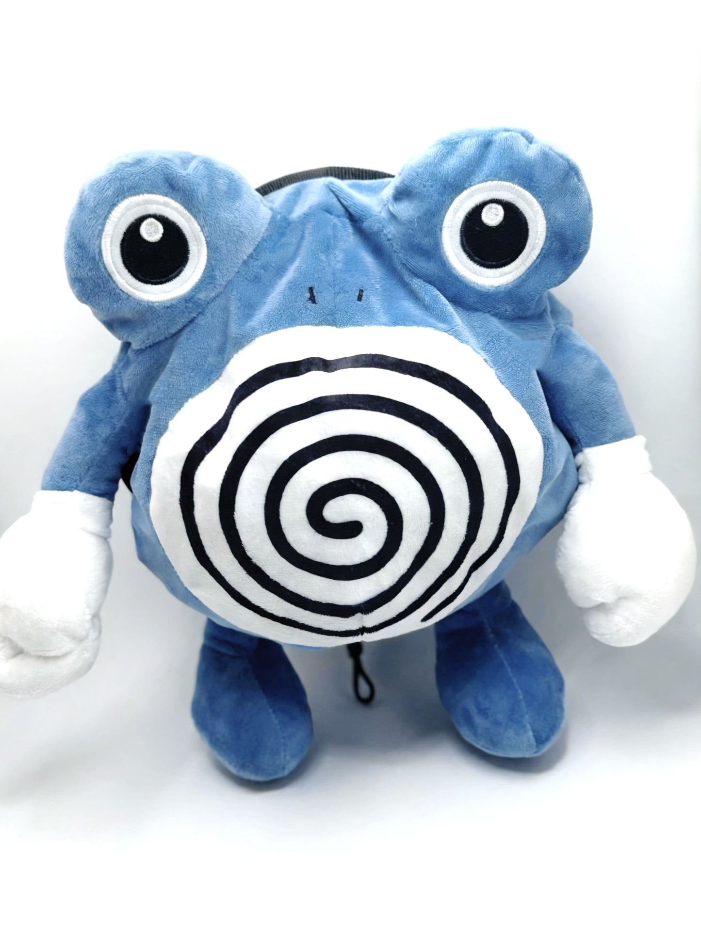A cute anime plush chalk bag by FATWORM featuring a blue tadpole with a black and white swirl on its belly and white gloves. This functional and fluffy bouldering accessory is handmade for bouldering and climbing for rock climbing, offering a long-durable design that makes the perfect climbing gift for a climber.