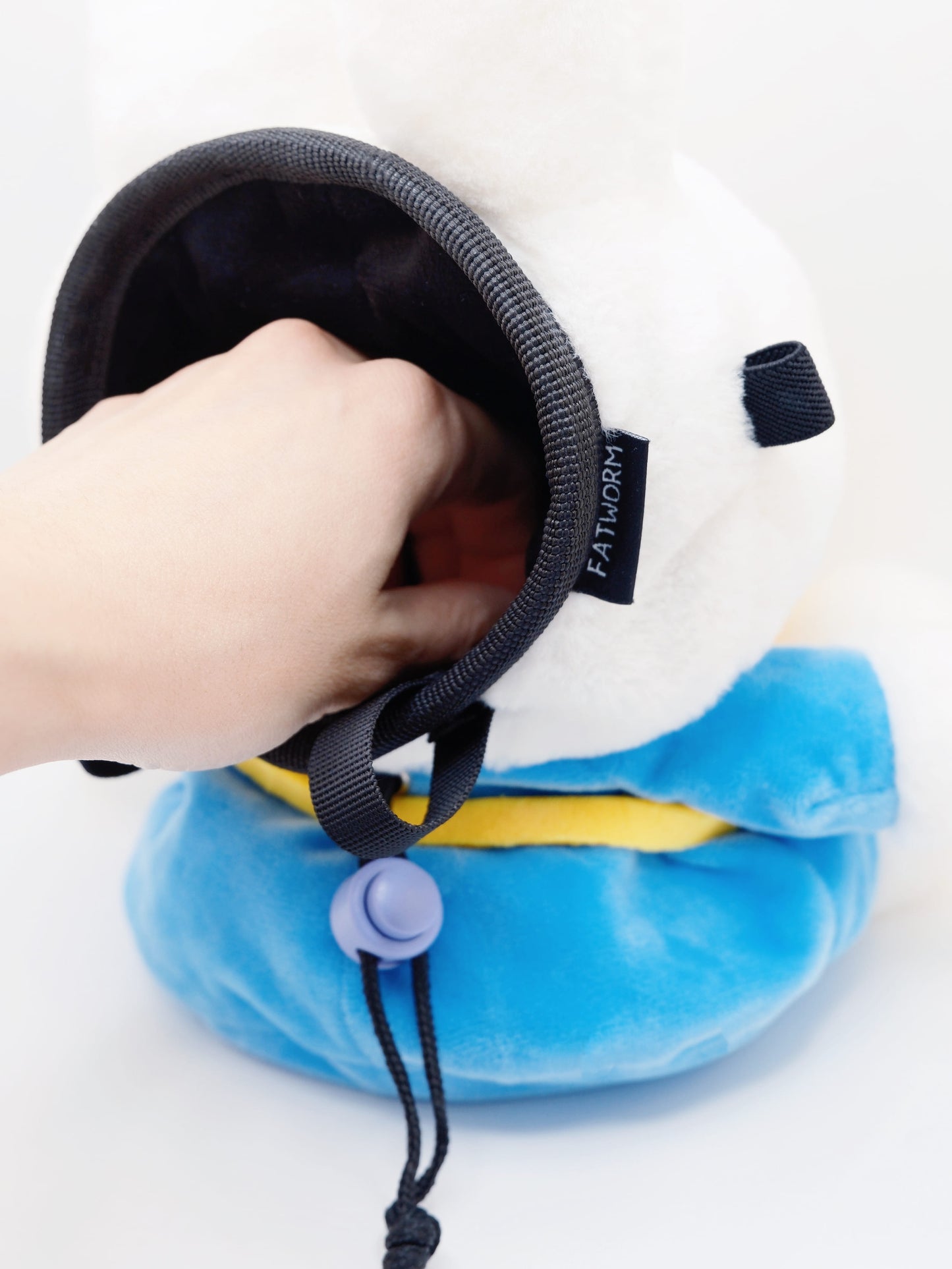 A cute anime plush chalk bag by FATWORM featuring a white Vanilla Bunny wearing a blue dress and a yellow star backpack. This functional and fluffy bouldering accessory is handmade for bouldering and climbing for rock climbing, offering a long-durable design that makes the perfect climbing gift for a climber.