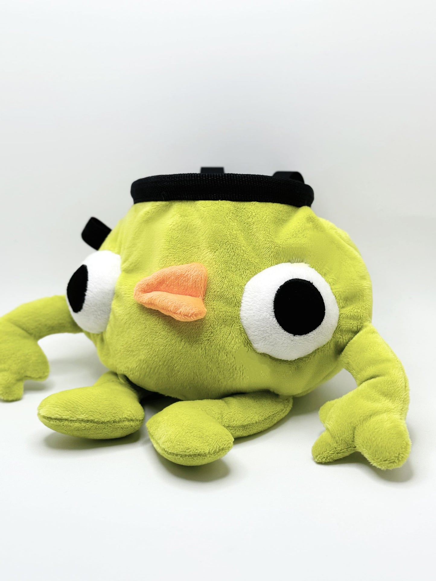 Soft plush climbing chalk bag shaped like a green game mascot with embroidered eyes. Inspired by the character Bing Bong from the co-op climbing video game PEAK. Handmade climbing chalk bag for bouldering and gym use by Fatworm