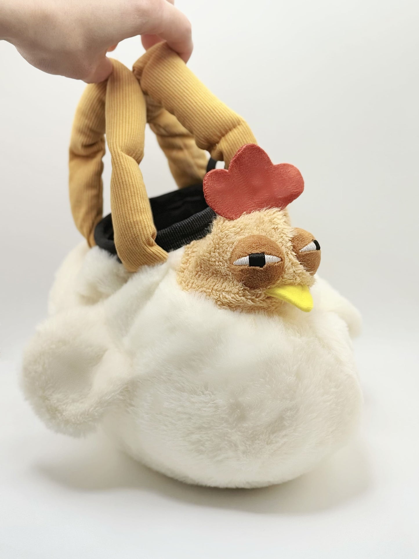 Chaotic chicken chalk bag with funny eyes, plush design, and handle – cute climbing gear for bouldering or gym use