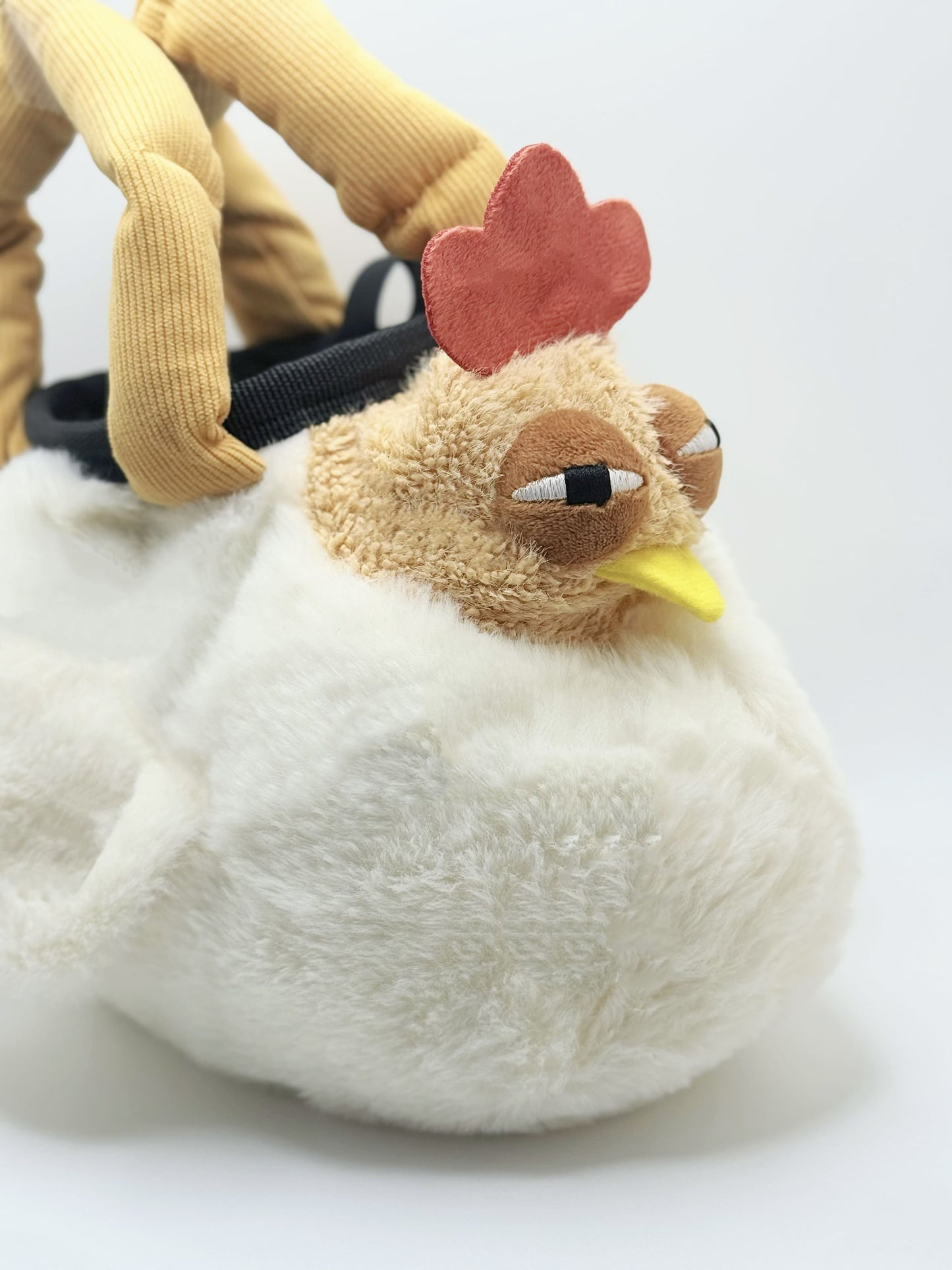 Chaotic chicken chalk bag with funny eyes, plush design, and handle – cute climbing gear for bouldering or gym use