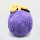 A soft and fluffy Gomu Gomu no Mi (Gum-Gum Fruit) plush chalk bag by Fatworm. This cute yet functional climbing gear features the iconic purple swirl pattern and a long-durable design. The perfect climbing gift for climbers who love unique, handmade gear.