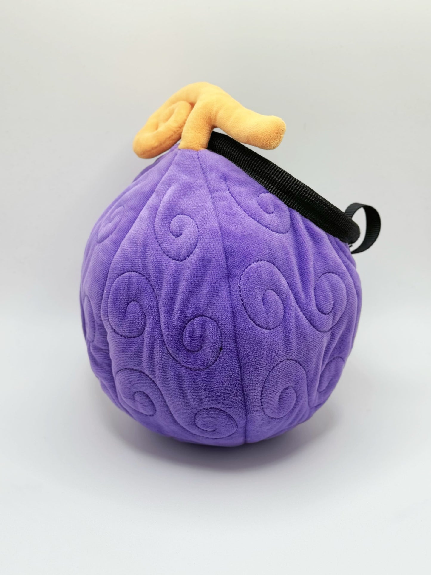 A soft and fluffy Gomu Gomu no Mi (Gum-Gum Fruit) plush chalk bag by Fatworm. This cute yet functional climbing gear features the iconic purple swirl pattern and a long-durable design. The perfect climbing gift for climbers who love unique, handmade gear.