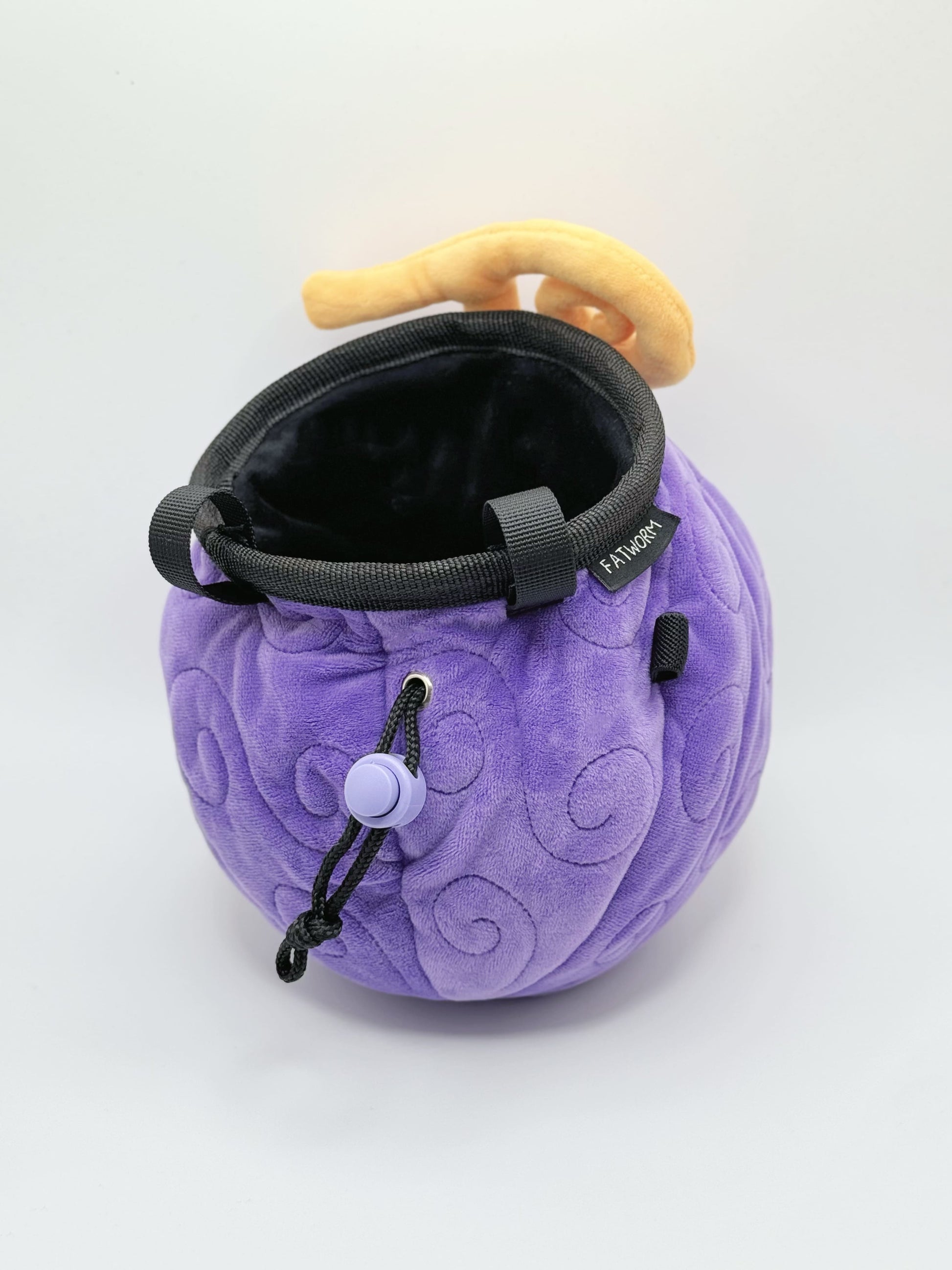 A soft and fluffy Gomu Gomu no Mi (Gum-Gum Fruit) plush chalk bag by Fatworm. This cute yet functional climbing gear features the iconic purple swirl pattern and a long-durable design. The perfect climbing gift for climbers who love unique, handmade gear.