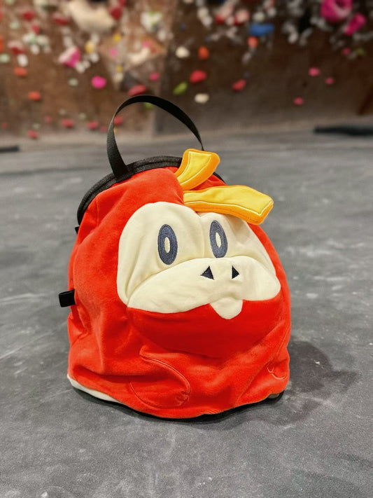 Pokémon Fuecoco climbing chalk bag/bucket featuring a soft plush exterior, spacious opening, and a stretchy brush holder, designed for rock climbers, handmade by Fatworm.