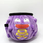 A cute anime plush chalk bag designed like Koffing by Fatworm. This functional purple bouldering and climbing accessory is handmade with a soft exterior, secure drawstring, and brush loop, making it perfect for rock climbing and a great gear addition for any climber.