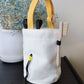 A cute anime plush chalk bag by Fatworm inspired by a famous fast food brand. This red functional bag features a vibrant yellow handle, a secure closure to prevent chalk spills, and a long-durable design, making it the perfect climbing gift for a climber into bouldering and climbing for rock climbing.