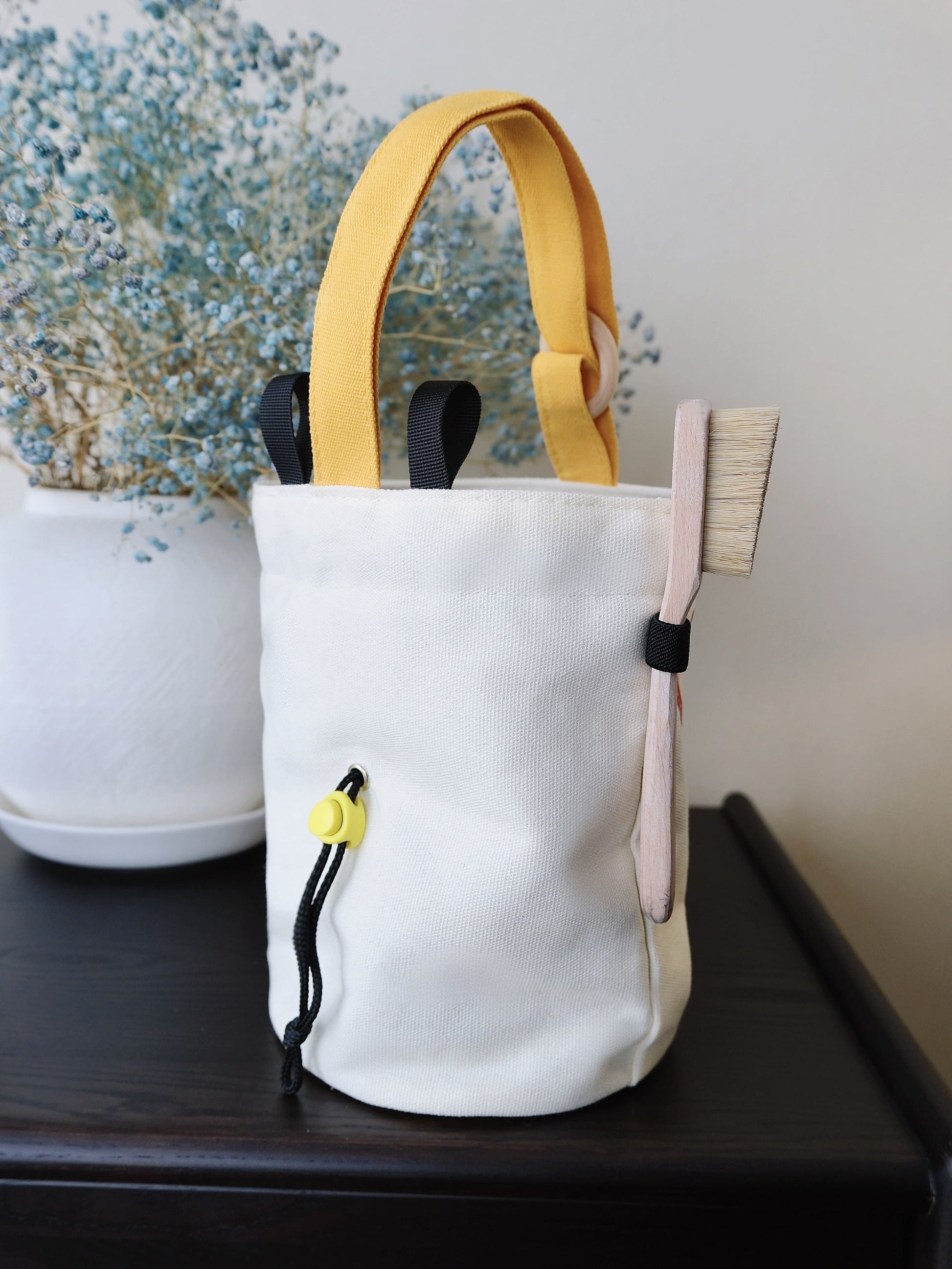 A cute anime plush chalk bag by Fatworm inspired by a famous fast food brand. This red functional bag features a vibrant yellow handle, a secure closure to prevent chalk spills, and a long-durable design, making it the perfect climbing gift for a climber into bouldering and climbing for rock climbing.