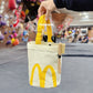 A cute anime plush chalk bag by Fatworm inspired by a famous fast food brand. This red functional bag features a vibrant yellow handle, a secure closure to prevent chalk spills, and a long-durable design, making it the perfect climbing gift for a climber into bouldering and climbing for rock climbing.