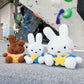 A cute anime plush miffy chalk bag by FATWORM featuring a white Vanilla Bunny wearing a blue dress and a yellow star backpack. This functional and fluffy bouldering accessory is handmade for bouldering and climbing for rock climbing, offering a long-durable design that makes the perfect climbing gift for a climber.