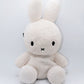 Cream beige plush Miffy climbing chalk bag featuring a cute bunny face; functional Fatworm Chalkbag gear.