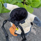 Level up with the Fatworm Mimikyu chalk bag. A handmade, soft, and durable bouldering bucket for climbers who love cute gear. The perfect functional gift!