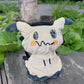 Level up with the Fatworm Mimikyu chalk bag. A handmade, soft, and durable bouldering bucket for climbers who love cute gear. The perfect functional gift!