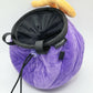 A soft and fluffy Gomu Gomu no Mi (Gum-Gum Fruit) plush chalk bag by Fatworm. This cute yet functional climbing gear features the iconic purple swirl pattern and a long-durable design. The perfect climbing gift for climbers who love unique, handmade gear.