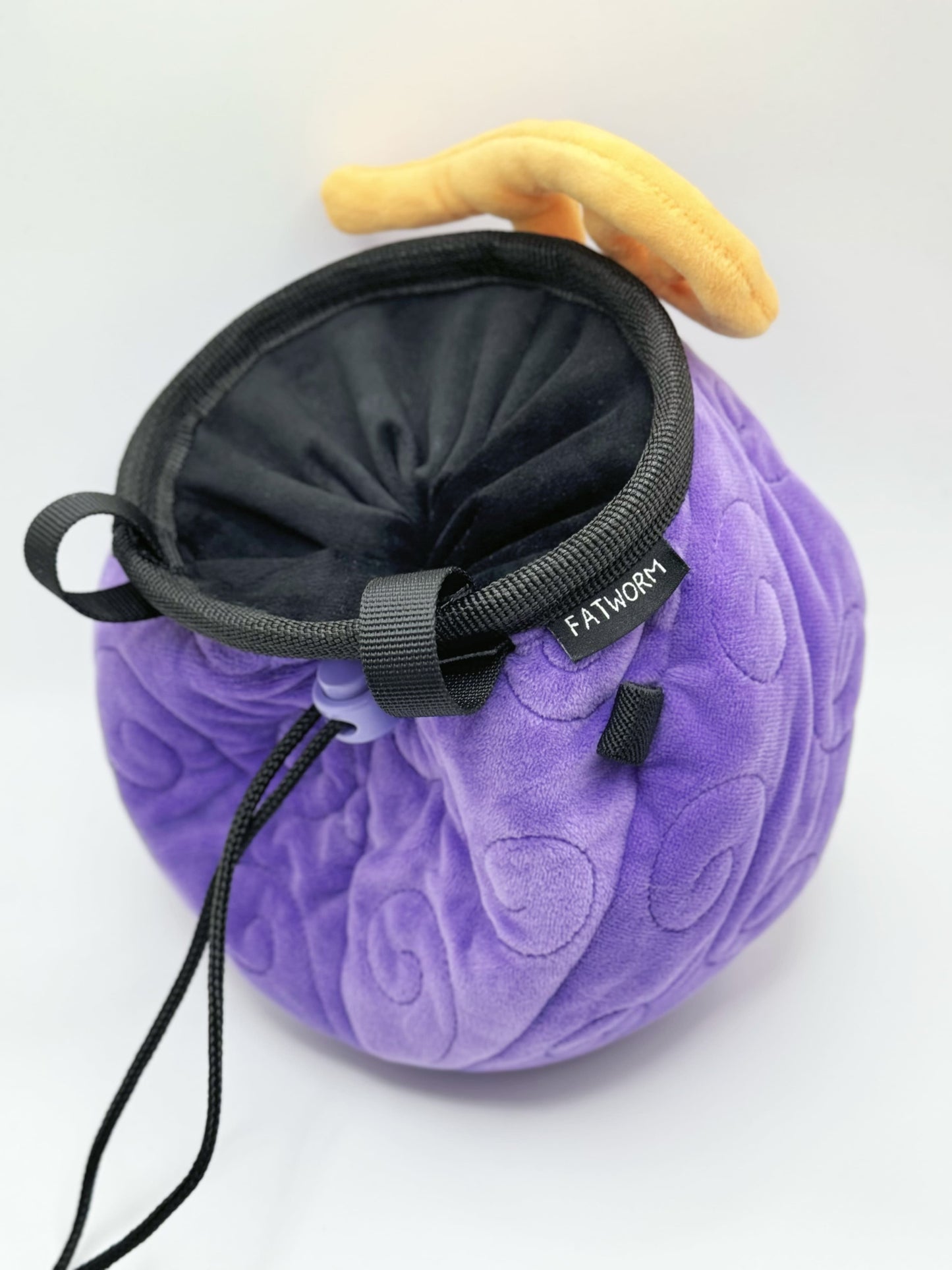 A soft and fluffy Gomu Gomu no Mi (Gum-Gum Fruit) plush chalk bag by Fatworm. This cute yet functional climbing gear features the iconic purple swirl pattern and a long-durable design. The perfect climbing gift for climbers who love unique, handmade gear.