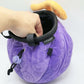 A soft and fluffy Gomu Gomu no Mi (Gum-Gum Fruit) plush chalk bag by Fatworm. This cute yet functional climbing gear features the iconic purple swirl pattern and a long-durable design. The perfect climbing gift for climbers who love unique, handmade gear.