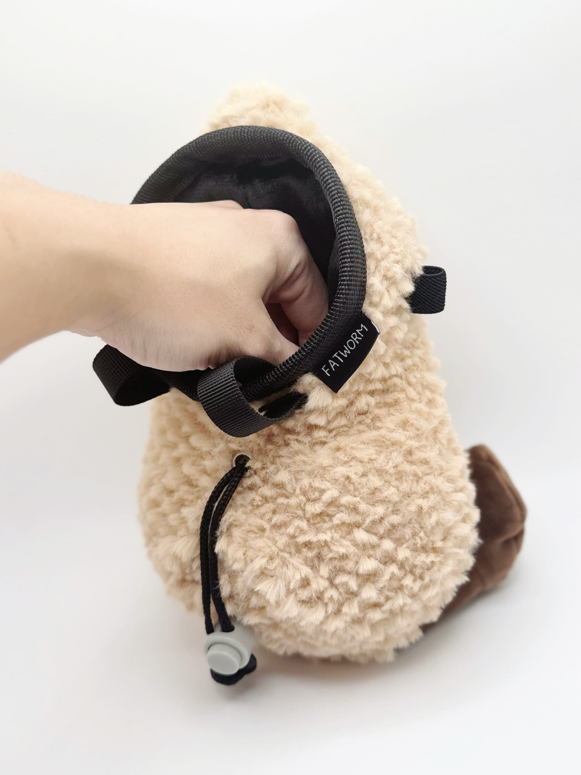 Happy Peanut Chalk Bag: a cute, plush climbing accessory with secure closure and soft lining. Perfect for bouldering and sport climbing.