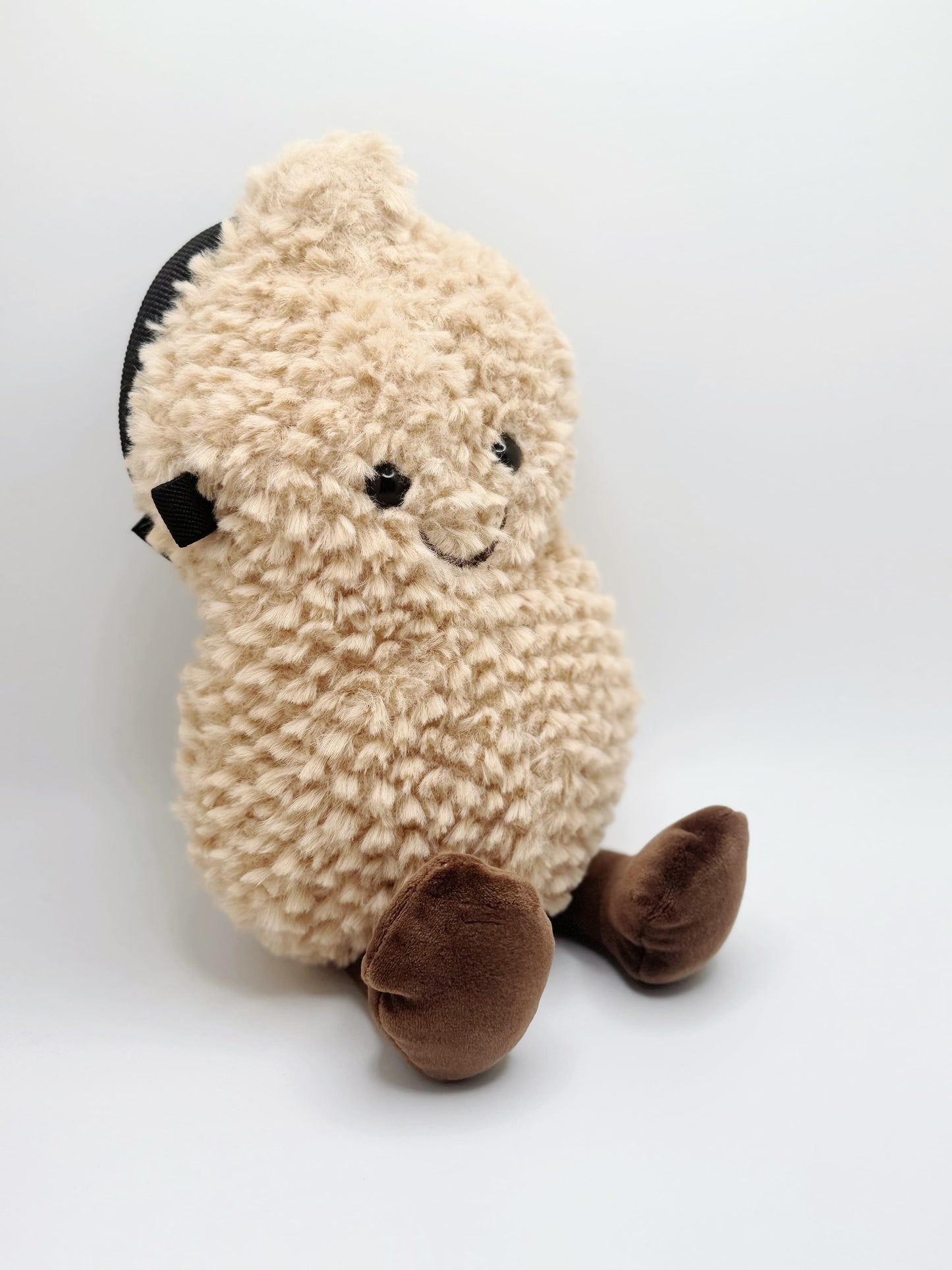 Happy Peanut Chalk Bag: a cute, plush climbing accessory with secure closure and soft lining. Perfect for bouldering and sport climbing.