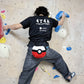 climber climbing on a rock wall with poke ball chalk bag cute functional anime plush chalk bag