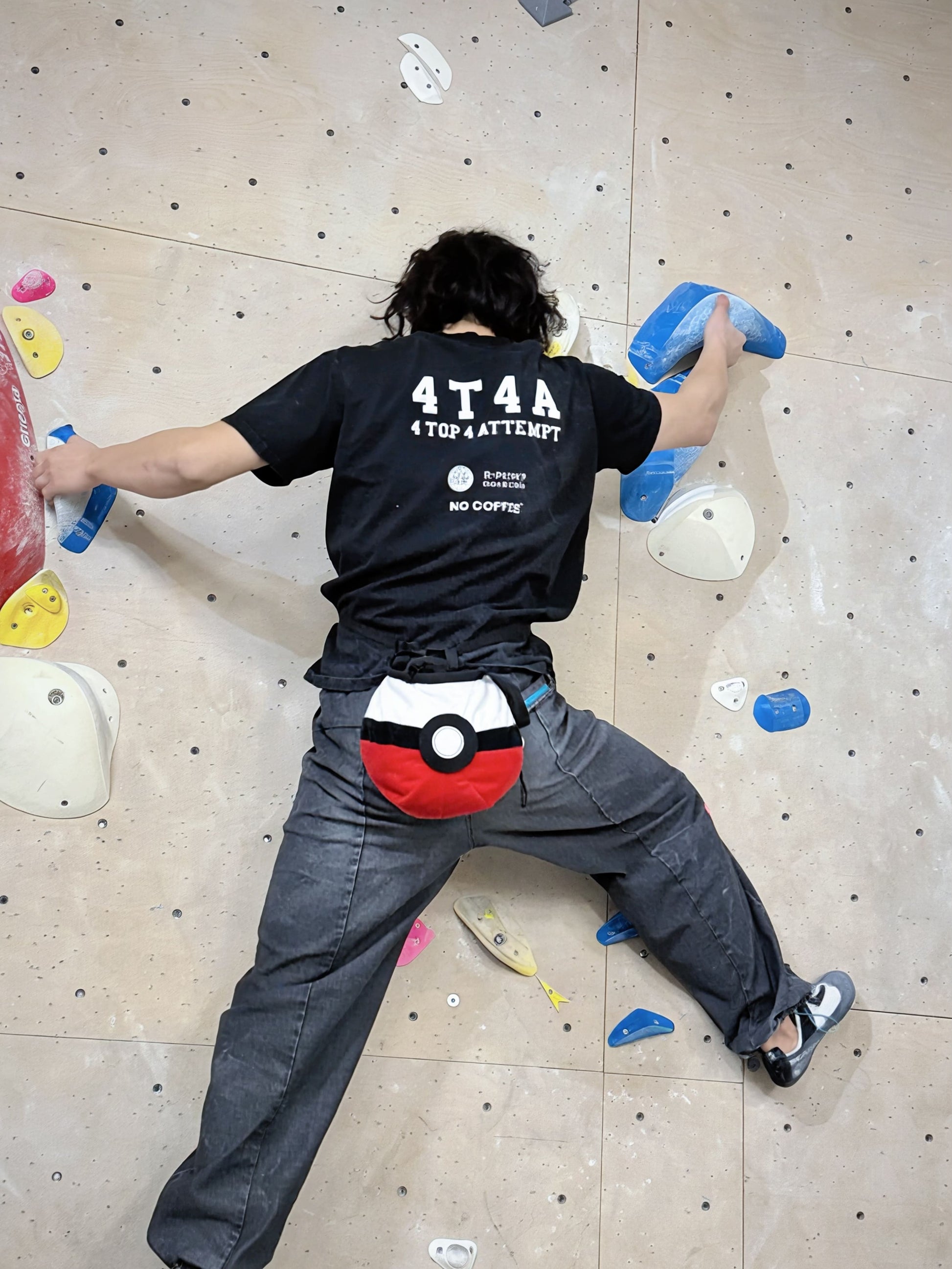 climber climbing on a rock wall with poke ball chalk bag cute functional anime plush chalk bag