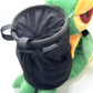 A cute, handmade plush climbing chalk bag designed to look like the Snivy, featuring a sleek green and cream body with yellow leaf-like accents and large, confident eyes. Designed with high functionality by a climber, it includes a wide black rim opening at the top for easy chalk access. A great climbing gift for trainers who want to catch them all.