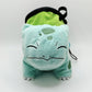 Sleeping Bulbasaur cute plush chalk bag featuring two eyes closed and a peaceful grin. A functional Grass-type plush and the perfect climbing gift for climbers.