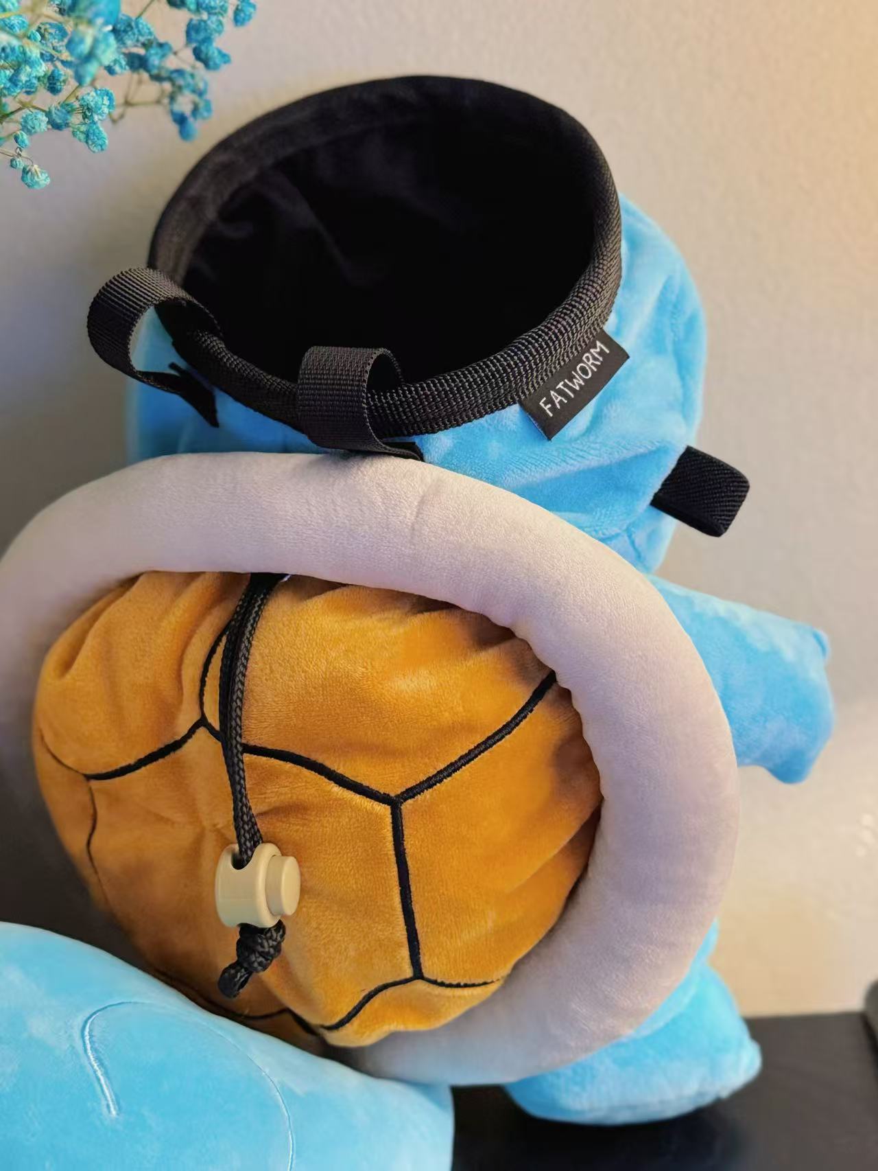 A soft and fluffy Squirtle plush bouldering chalk bag by Fatworm. This cute yet functional climbing gear features a long-durable wide-base design, making it the perfect climbing gift for climbers who love unique, handmade accessories.